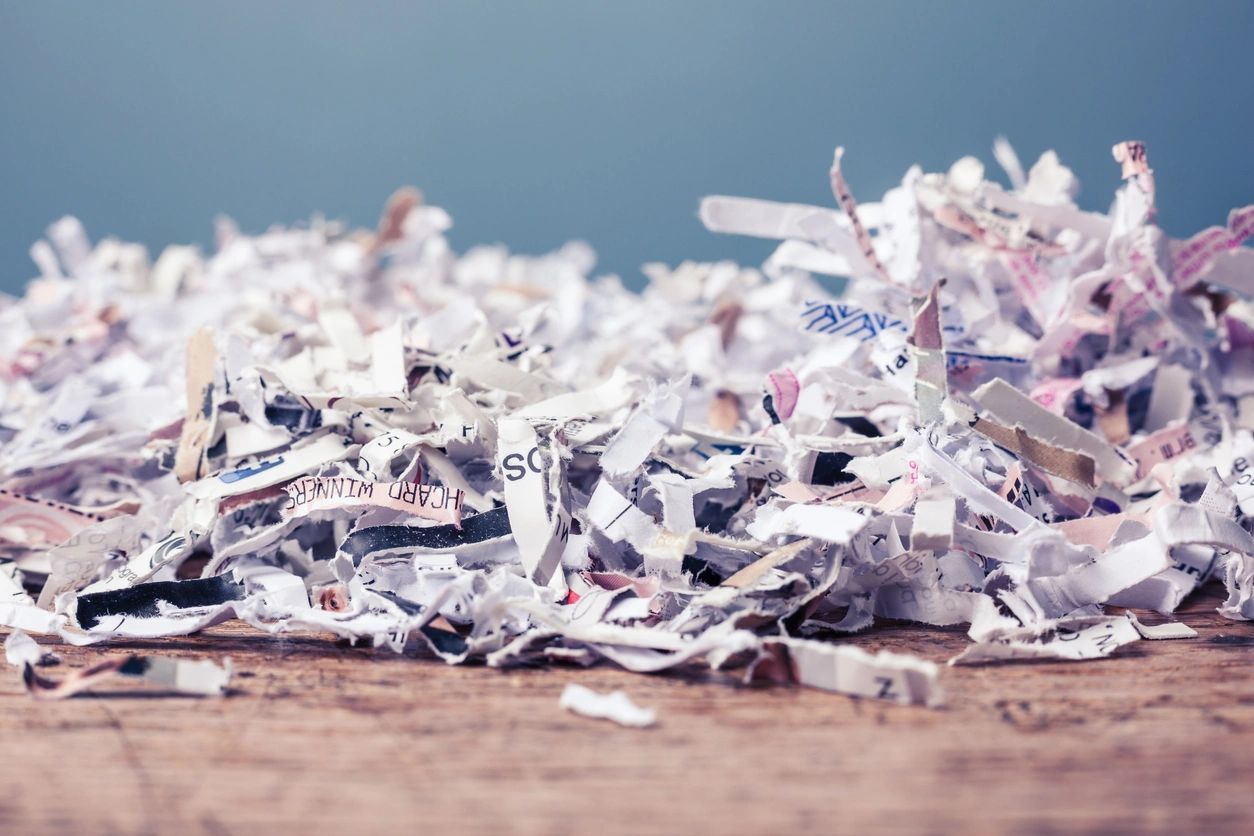 A pile of shredded paper on the ground.
